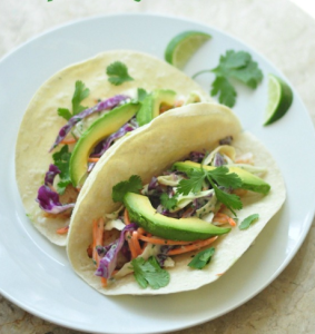 Fish tacos with cabbage slaw and avocado